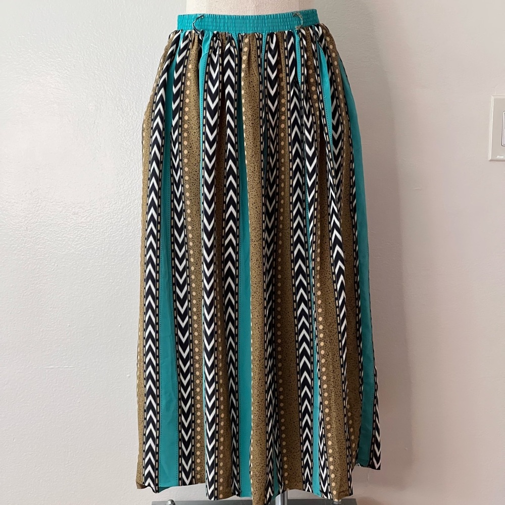 Southwestern pattern skirt with elastic waist, pockets, and raw hem
